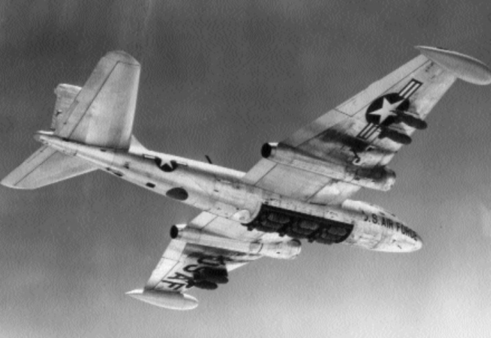 A Martin B-57 over South Vietnam with its rotary bomb door open, 1966.