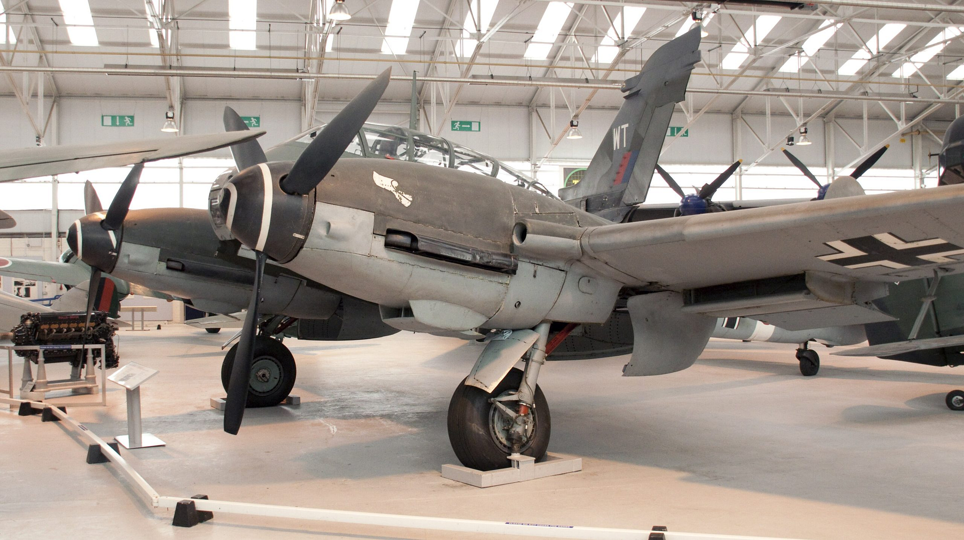 A preserved Messerschmitt Me 410 Hornisse heavy fighter on museum display.