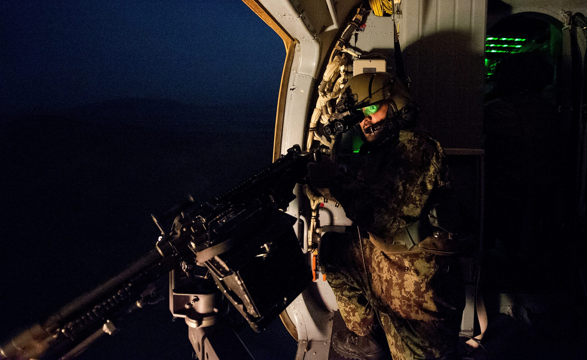 Aerial gunner aboard an Afghan Air Force Mil Mi-17 Hip