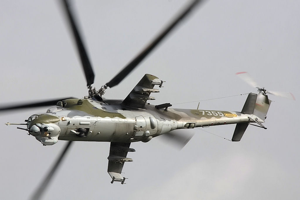 Mil Mi-24 Hind gunship helicopter banking in flight