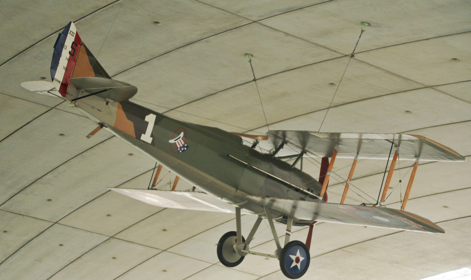 Preserved SPAD S.XIII biplane fighter on museum display, colour photograph