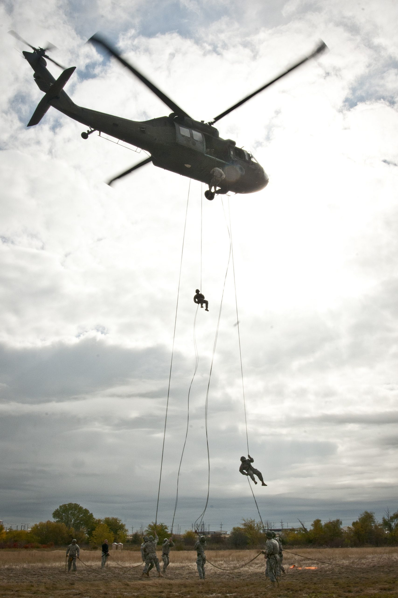 Soldiers rappelling from a UH-60 Black Hawk