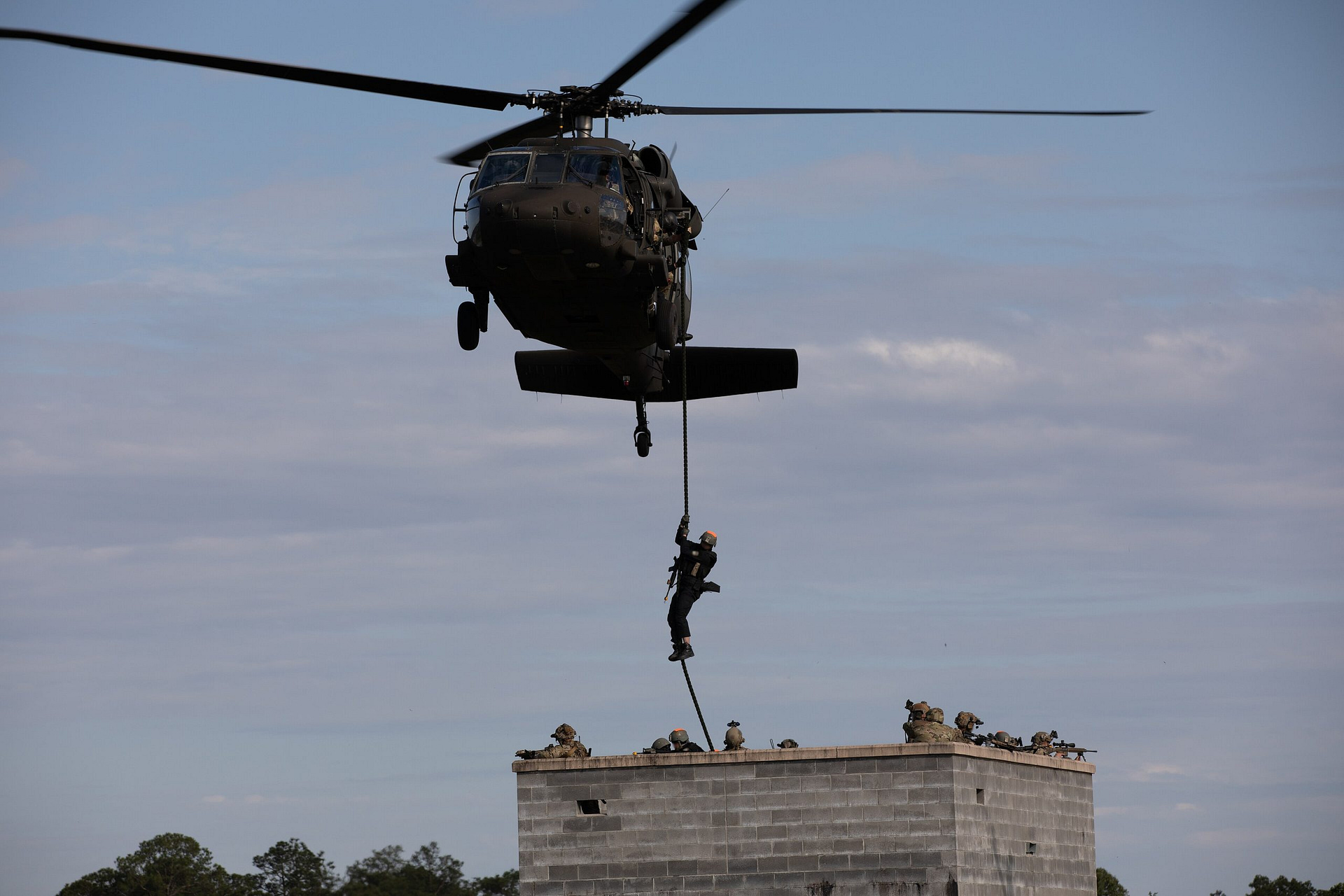 Troops fast-roping from a UH-60 Black Hawk