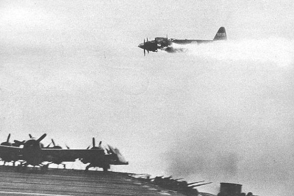 A Japanese Frances presses a low attack run on a US escort carrier, 1945.