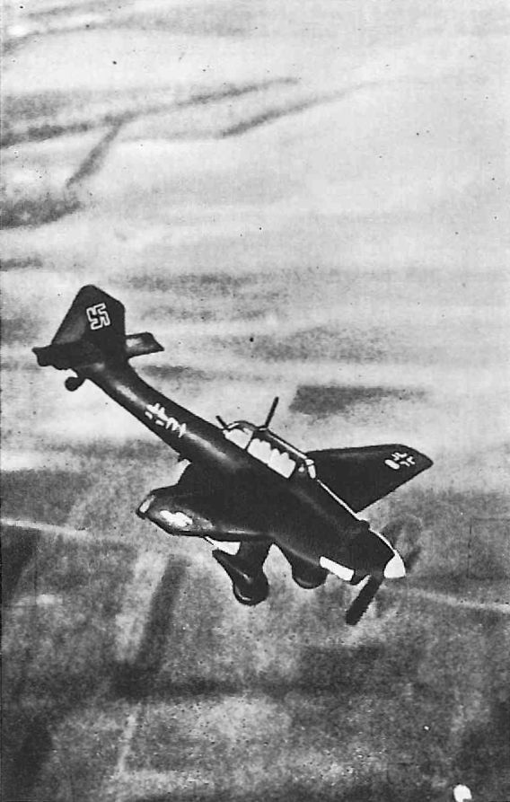 A Stuka in its element: a steep diving attack, wing brakes deployed to hold a safe speed.