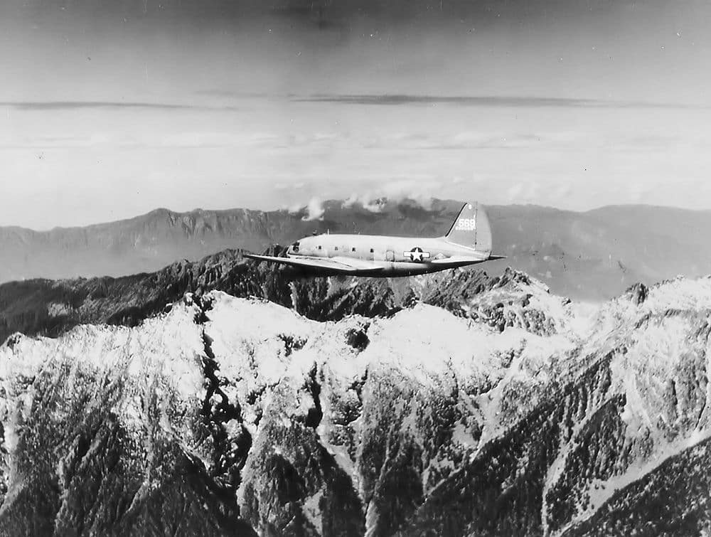An Air Transport Command C-46 Commando flying The Hump over the Himalayas