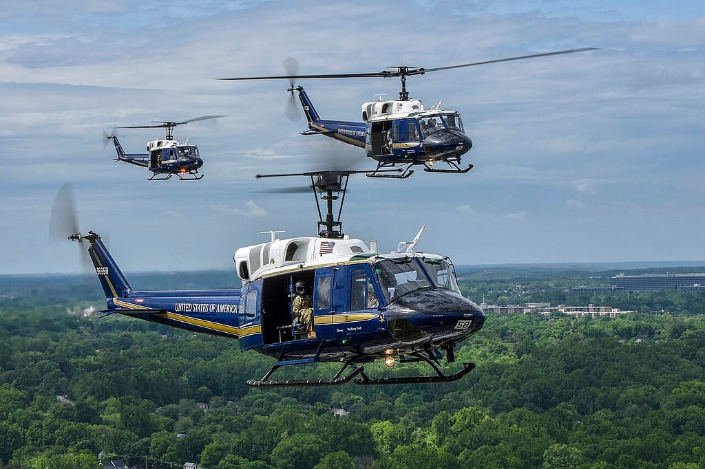 UH-1N Huey helicopters fly over Joint Base Andrews, Maryland