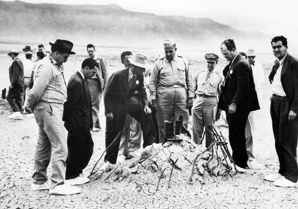 Oppenheimer and Groves at the remains of the Trinity tower