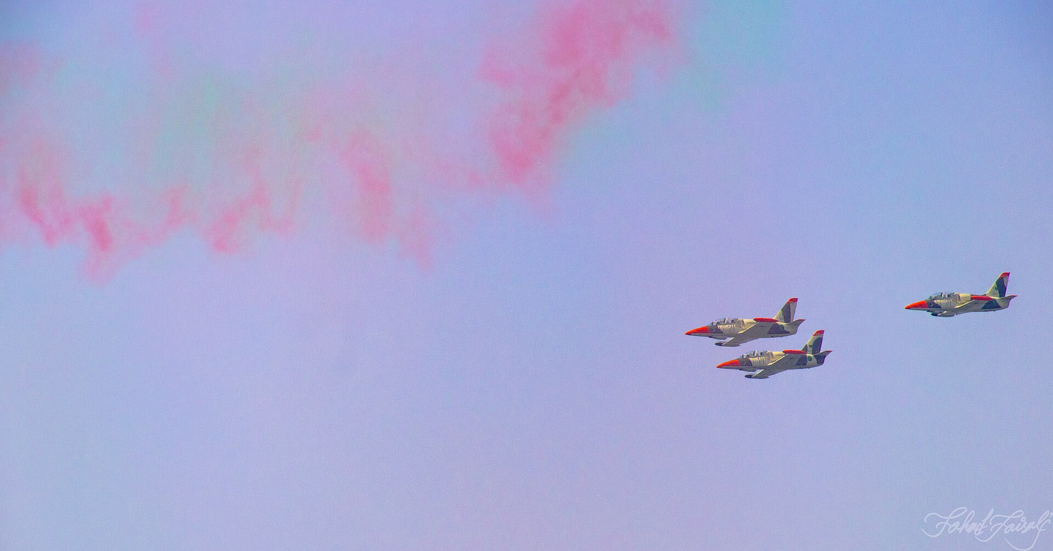 Aero L-39 Albatros jet trainers in formation flight with display smoke