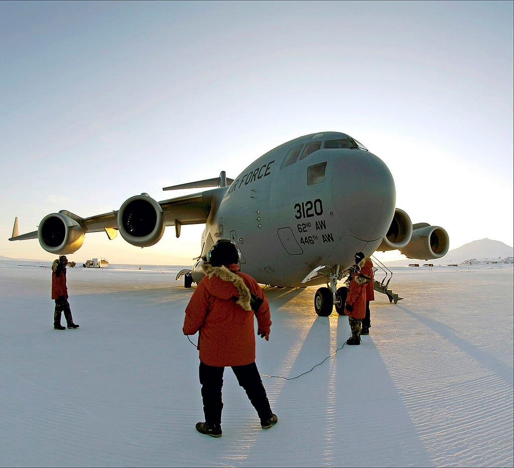 Airmen prep a C-17 for an Operation Deep Freeze flight