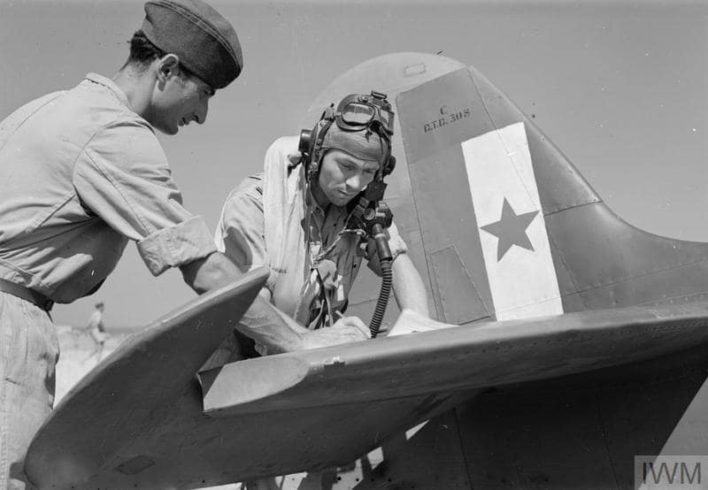 No. 352 Squadron pilot signing for his Spitfire