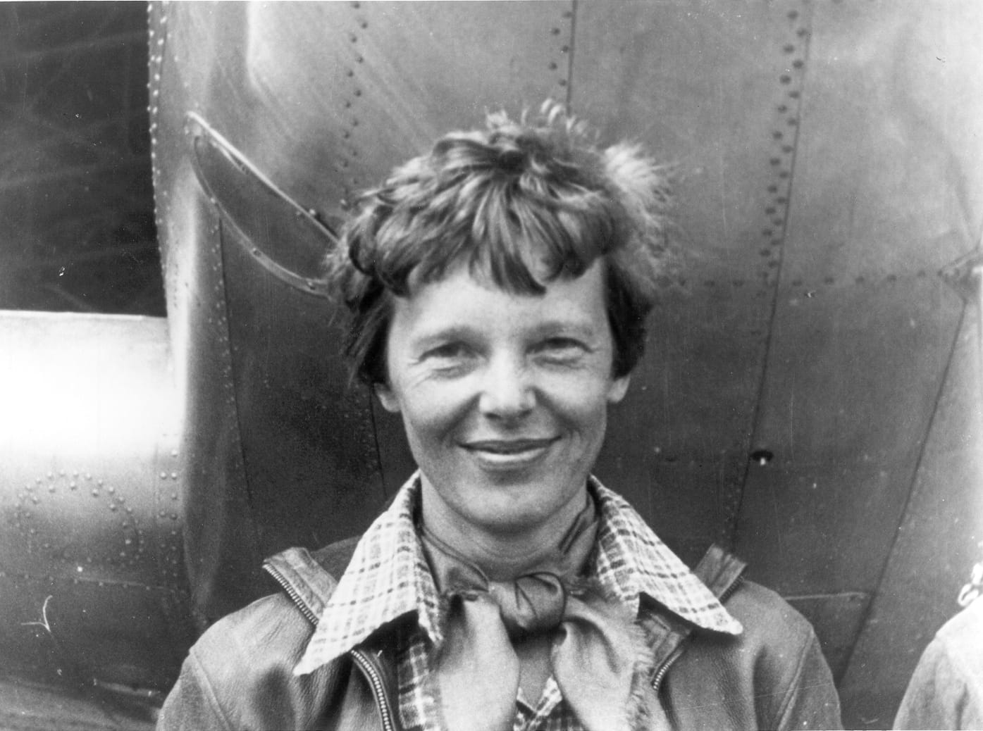 Amelia Earhart beneath her Lockheed Model 10-E Electra