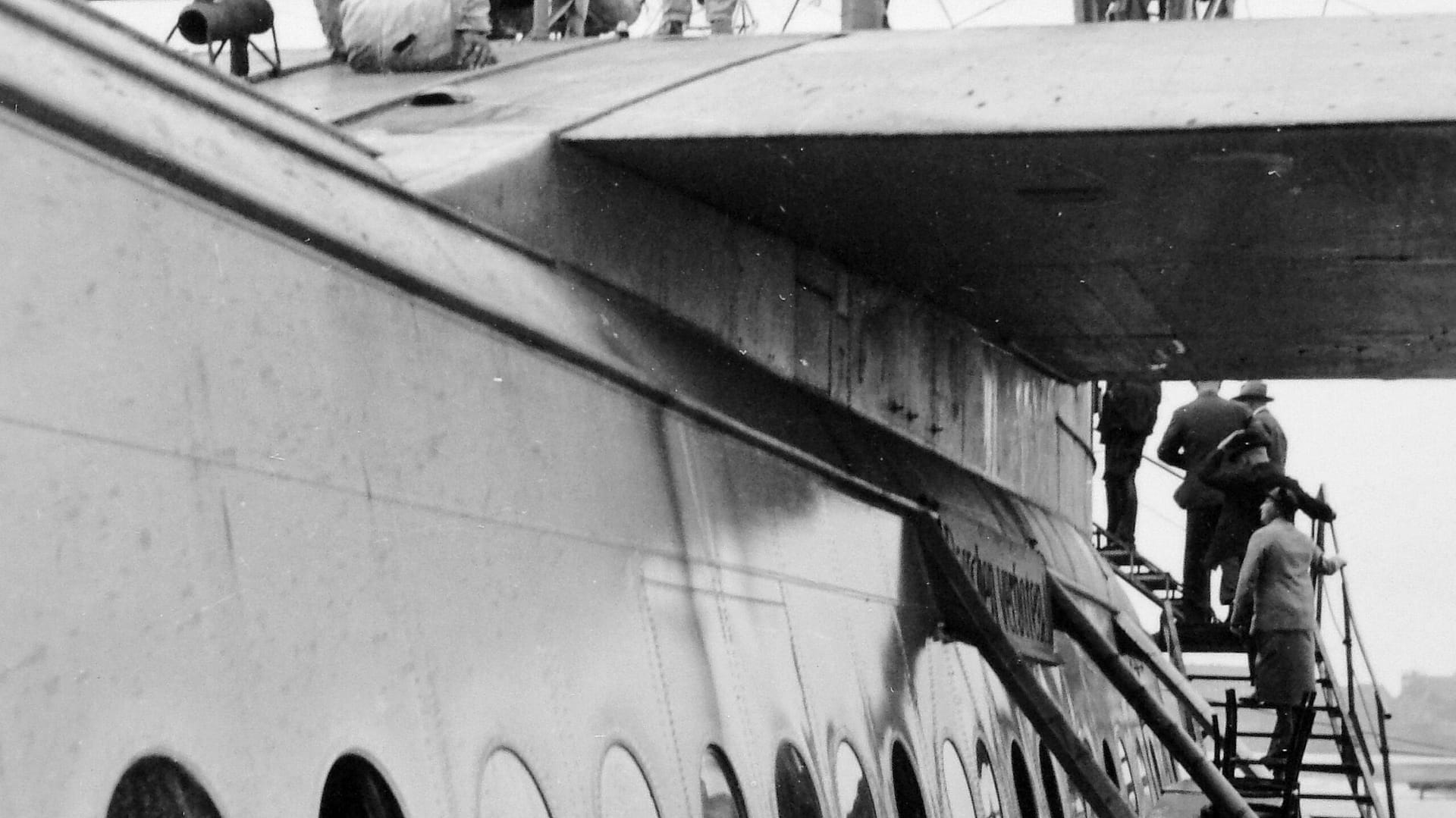 The hull and wing of the Dornier Do X, the giant 12-engine flying boat of 1929, showing its scale and row of portholes