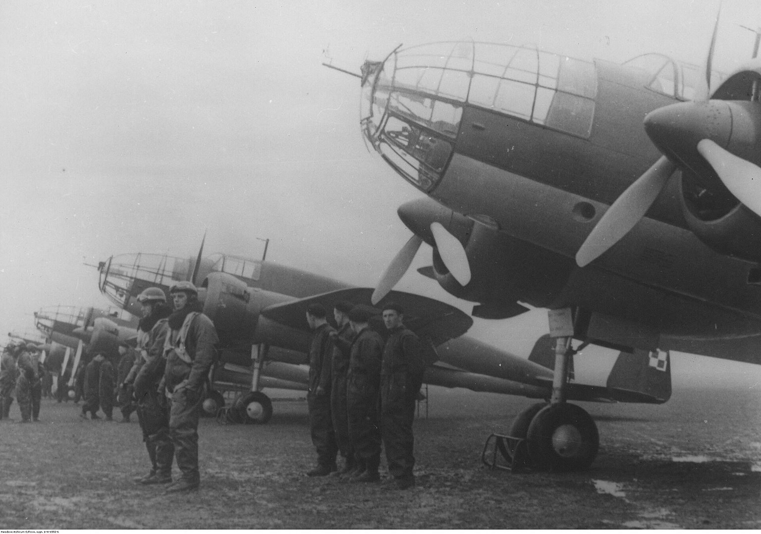 A PZL.37 Łoś parked on a grass airfield