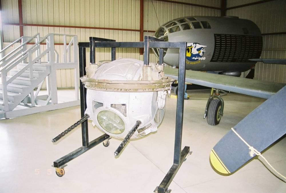 Sperry ball turret mounted beneath a B-17 Flying Fortress on display at a museum