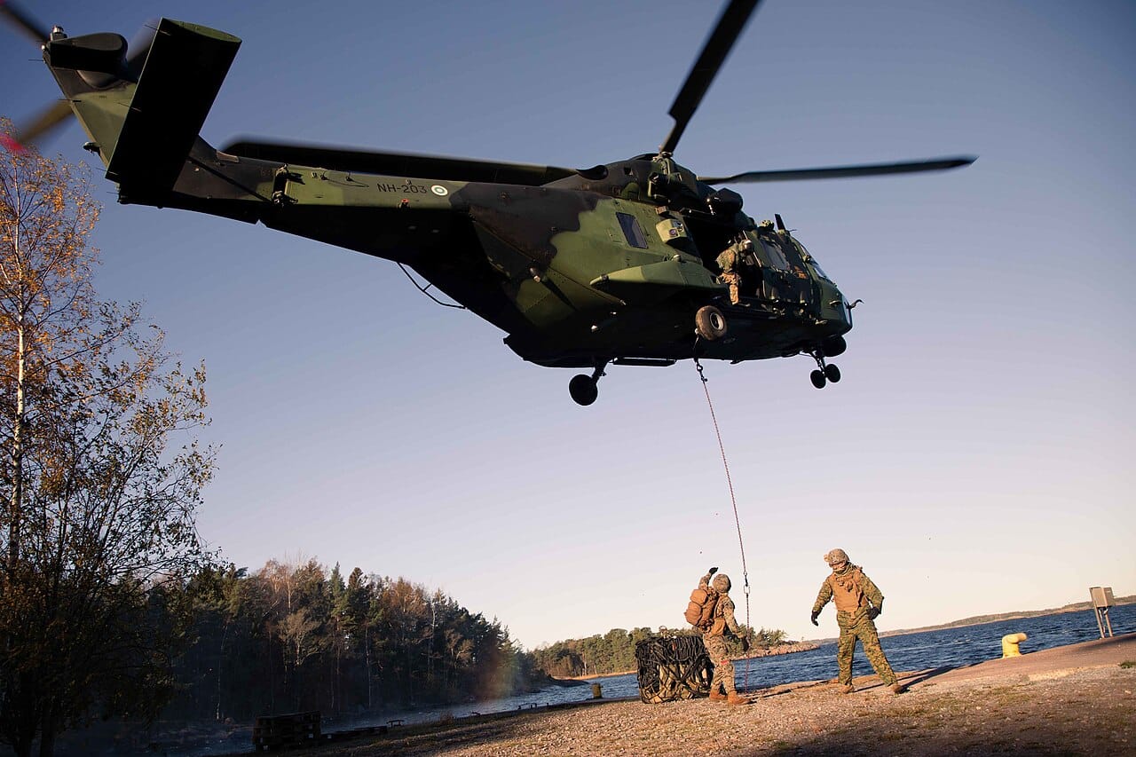 Marines conducting helicopter resupply with Finnish soldiers