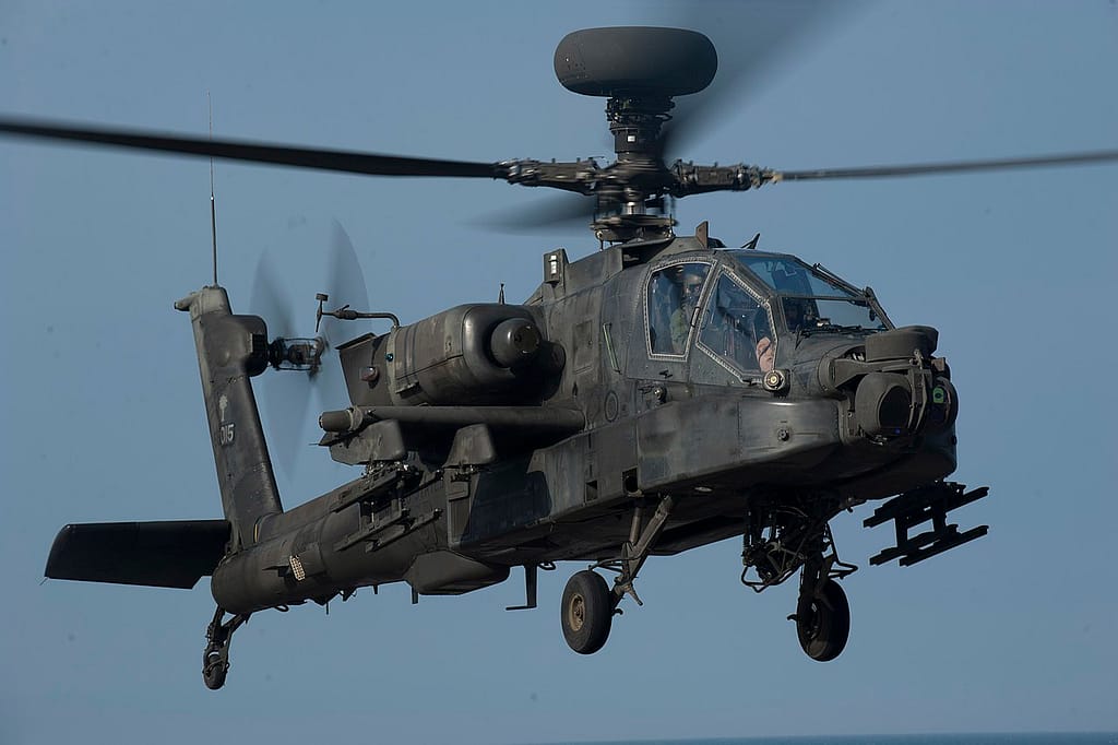 US Army AH-64 Apache approaching an amphibious assault ship flight deck