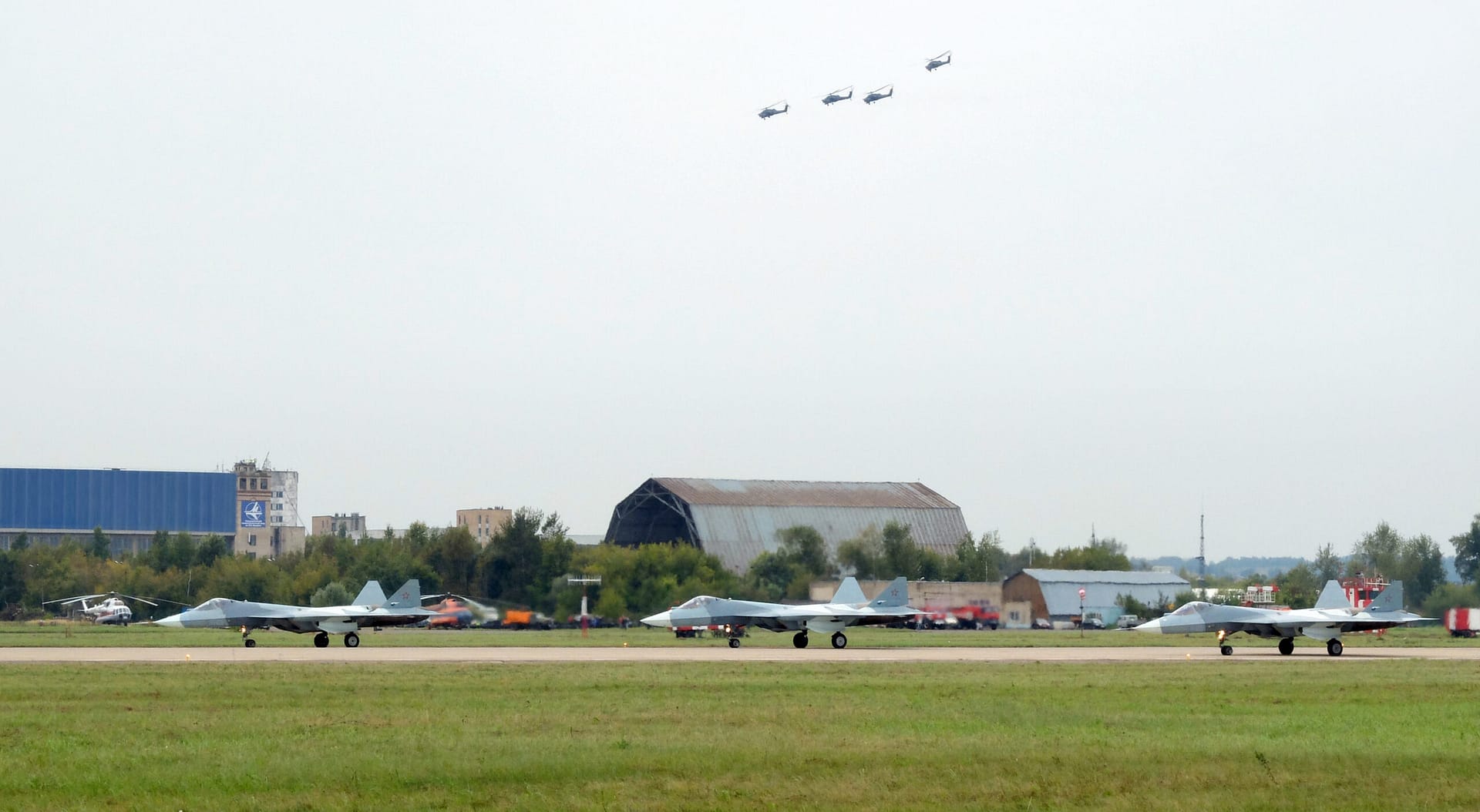 Three Russian Sukhoi Su-57 fifth-generation stealth fighters flying in formation