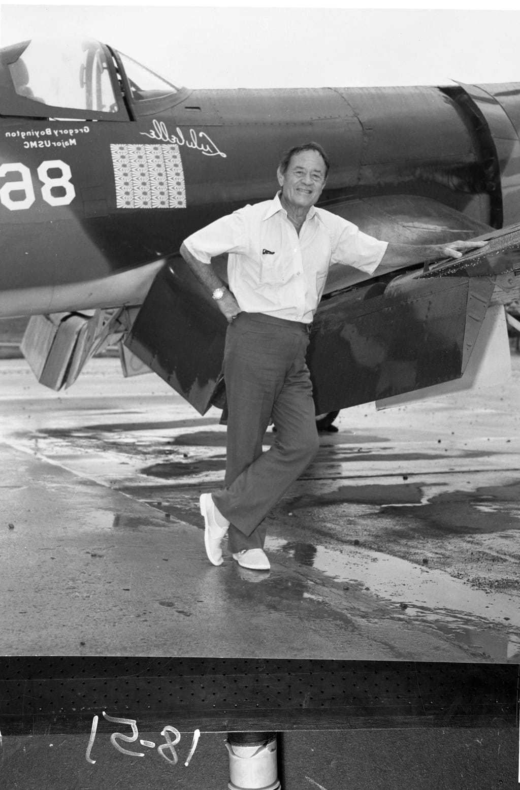 Pappy Boyington beside an F4U Corsair