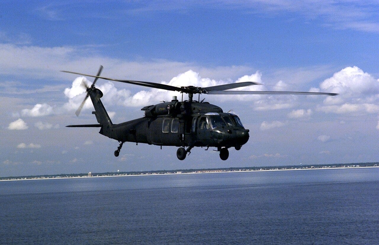 An MH-60L Black Hawk of the 160th Special Operations Aviation Regiment flying low and fast along the Florida coast