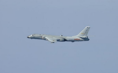 Two J-20s Escort a Very Big Missile