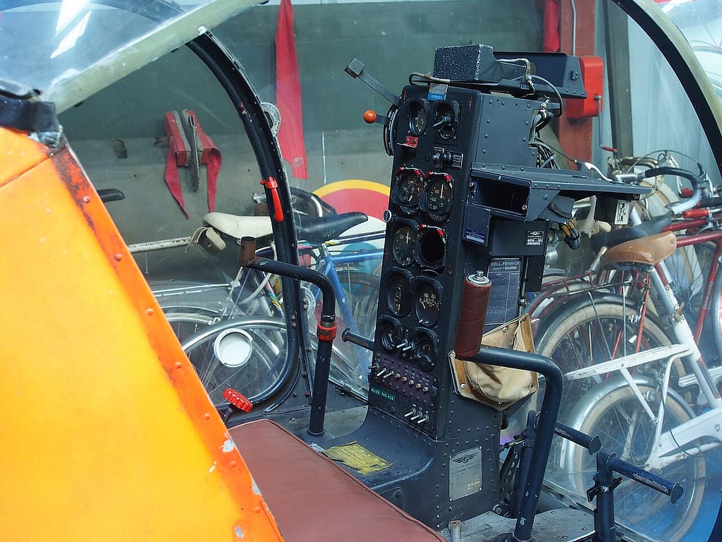 The cockpit of a Bell 47 seen through the bubble canopy