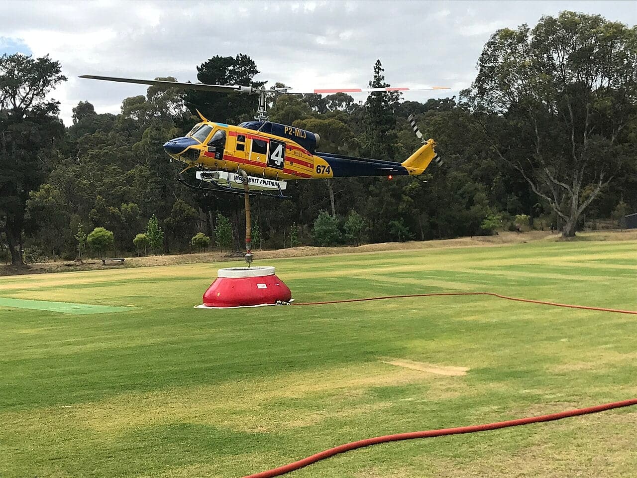 McDermott Aviation Bell 214 firefighting helicopter refilling
