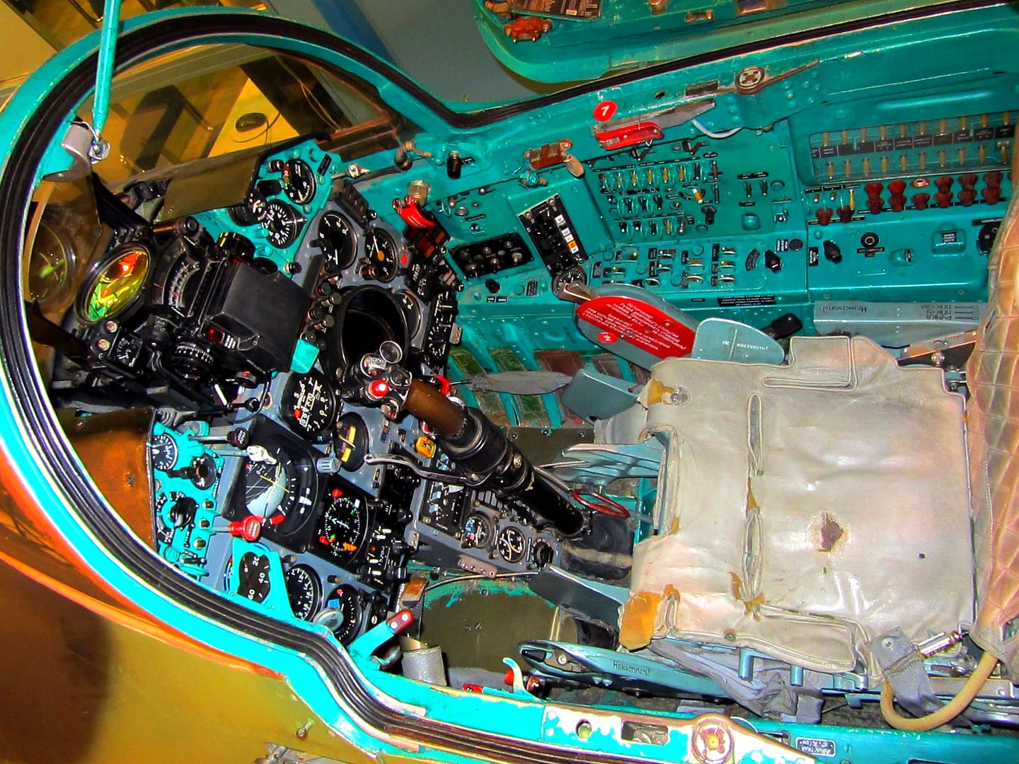MiG-21bis cockpit vivid turquoise green interior MiG-21bis cockpit interior painted in vivid turquoise green — the iconic Soviet cockpit color designed to reduce eye strain and prevent afterimages