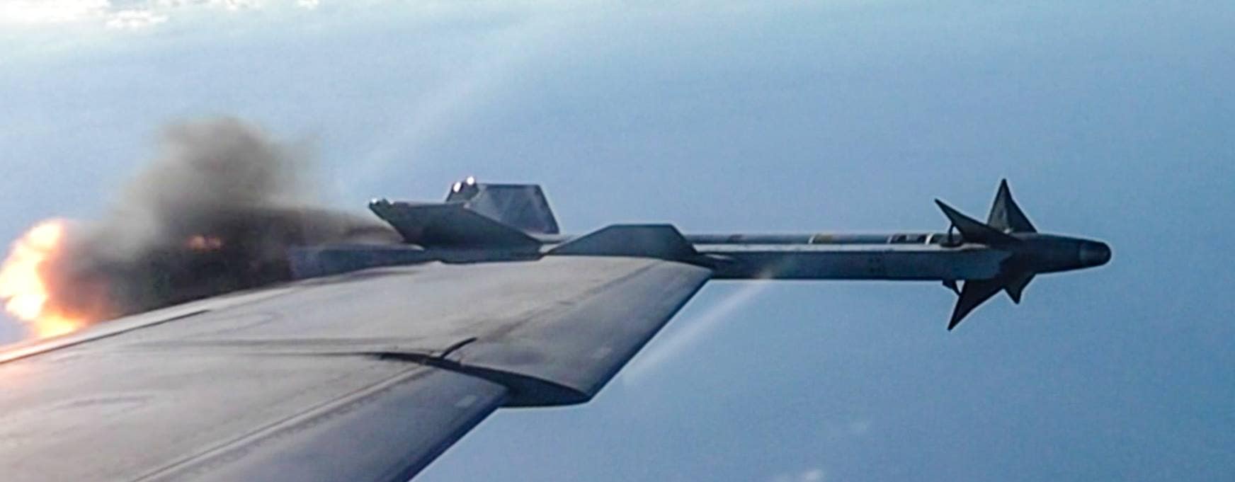An air-to-air Sidewinder missile launch, just as it starts leaving the wing