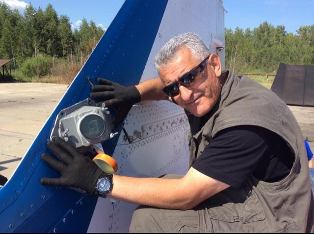 Artur Sarkisyan attaching a camera to the MiG-29UB fin