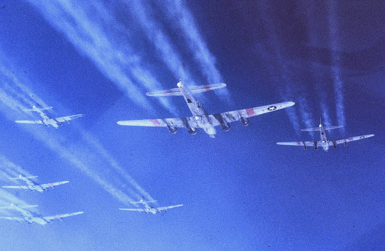 B-17G Flying Fortress bombers in tight formation during a WWII bombing mission over Europe